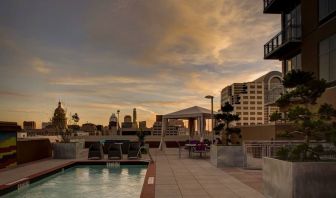 Outdoor pool at sunset at Hampton Inn & Suites Austin @ The UniversityCapitol.