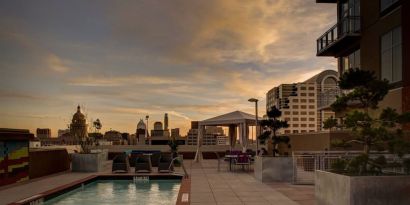 Outdoor pool at sunset at Hampton Inn & Suites Austin @ The UniversityCapitol.