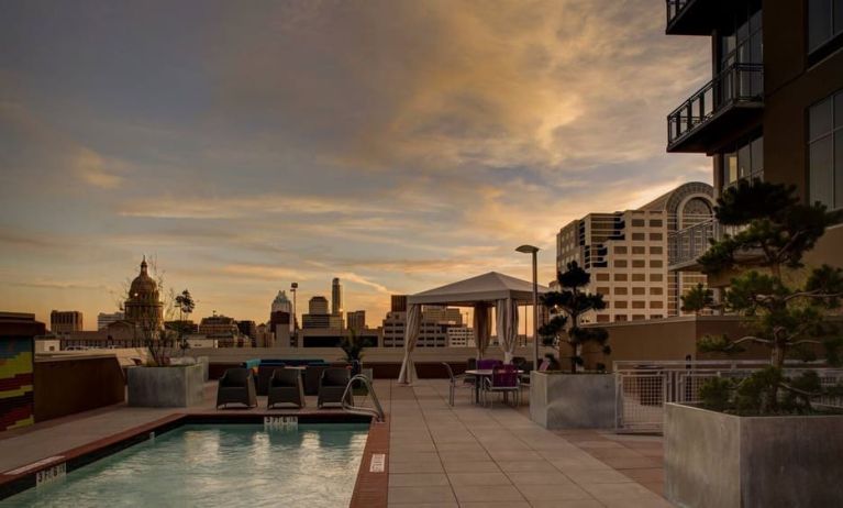 Outdoor pool at sunset at Hampton Inn & Suites Austin @ The UniversityCapitol.