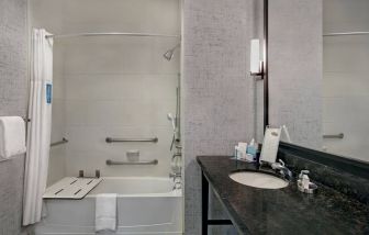 Guest bathroom with shower at Hampton Inn & Suites Austin @ The UniversityCapitol.