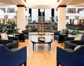 Coworking space and lobby at Embassy Suites By Hilton Portland Airport.