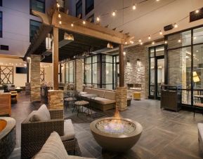 Coworking and lobby area with fire place at Homewood Suites By Hilton Louisville Downtown.