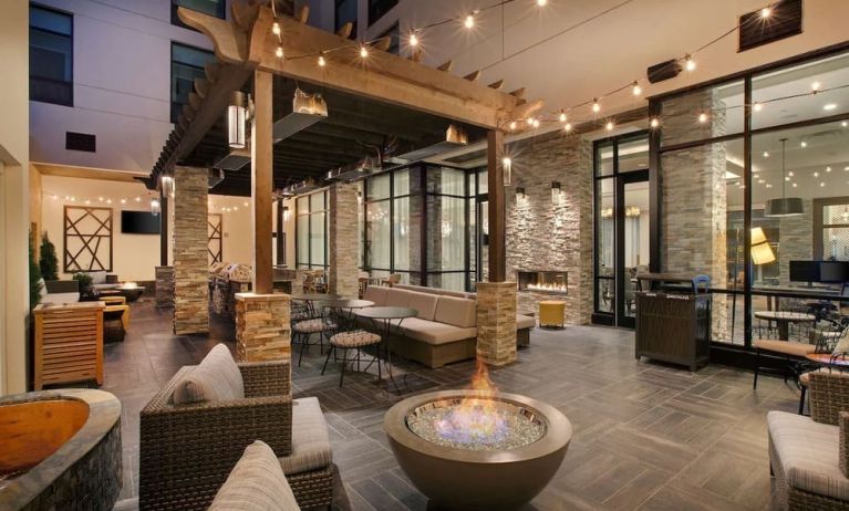 Coworking and lobby area with fire place at Homewood Suites By Hilton Louisville Downtown.