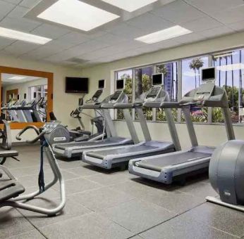 Fitness center at Embassy Suites By Hilton San Diego-La Jolla.