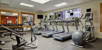 Fitness center at Embassy Suites By Hilton San Diego-La Jolla.