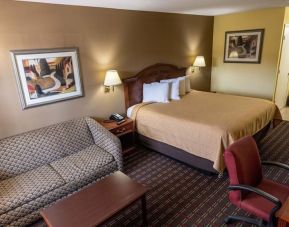 Spacious king room with work station at Loyalty Inn Hawkinsville.