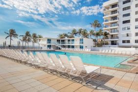 Outdoor pool and palm trees at New Point Miami.