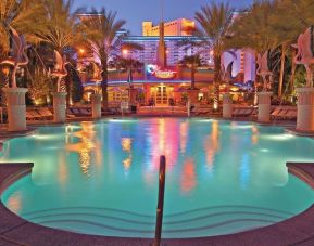 Outdoor pool at night at Flamingo Las Vegas.