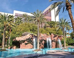 Outdoor pool with palm trees at Flamingo Las Vegas.