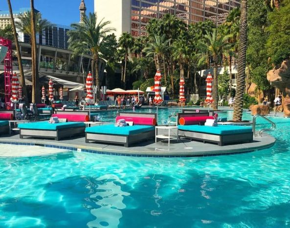 Outdoor pool with lounge beds at Flamingo Las Vegas.