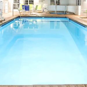 Indoor pool at Coratel Inn & Suites By Jasper Rochester.