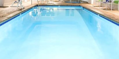 Indoor pool at Coratel Inn & Suites By Jasper Rochester.