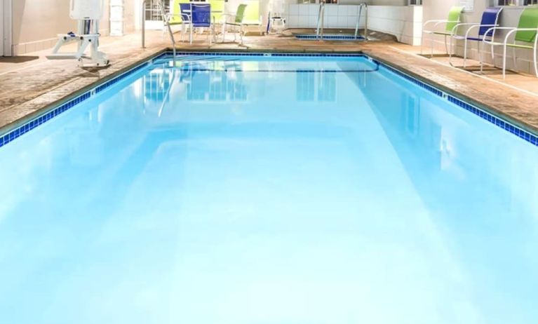 Indoor pool at Coratel Inn & Suites By Jasper Rochester.