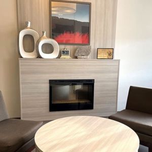 Coworking and fire place at Coratel Inn & Suites By Jasper Rochester.