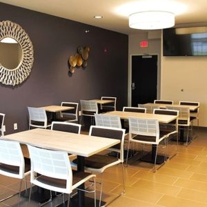 Professional meeting room at Coratel Inn & Suites By Jasper Rochester.