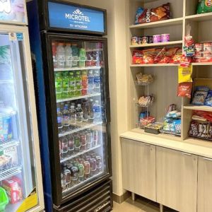 Snack bar at Coratel Inn & Suites By Jasper Rochester.