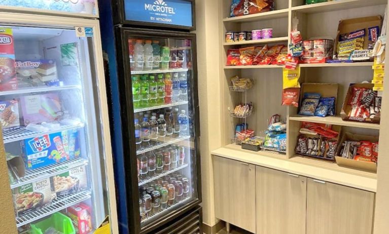 Snack bar at Coratel Inn & Suites By Jasper Rochester.