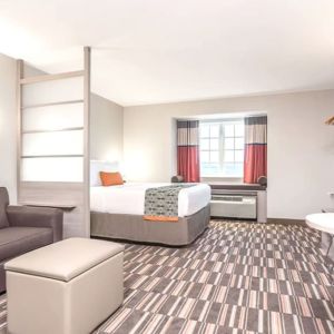 Spacious king suite at Coratel Inn & Suites By Jasper Rochester.