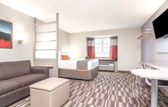 Spacious king suite at Coratel Inn & Suites By Jasper Rochester.