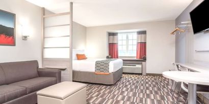 Spacious king suite at Coratel Inn & Suites By Jasper Rochester.