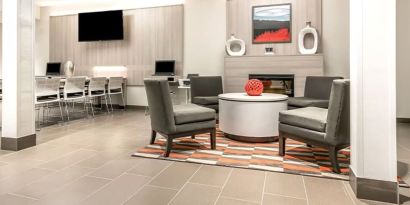 Lobby and coworking space at Coratel Inn & Suites By Jasper Rochester.