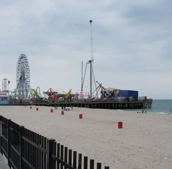 Beach arcade and promenade nearby at Bay Breeze Motel.