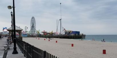 Beach arcade and promenade nearby at Bay Breeze Motel.