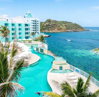 Stunning outdoor pool and ocean view at Oyster Bay Beach Resort.