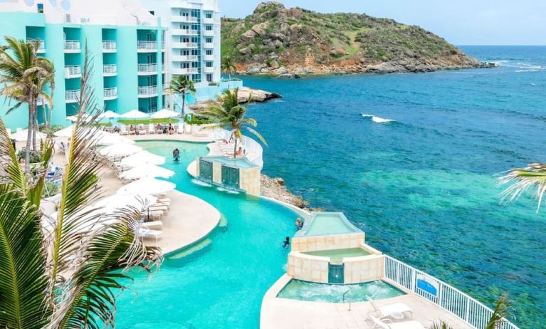 Stunning outdoor pool and ocean view at Oyster Bay Beach Resort.