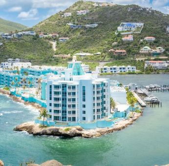 Hotel exterior with sea view and beach access at Oyster Bay Beach Resort.