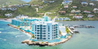 Hotel exterior with sea view and beach access at Oyster Bay Beach Resort.