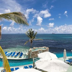 Relaxing outdoor pool and ocean view at Oyster Bay Beach Resort.