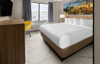 King room with natural light at Days Inn By Wyndham Staten Island.