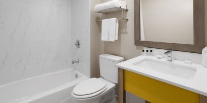 Guest bathroom at Days Inn By Wyndham Staten Island.