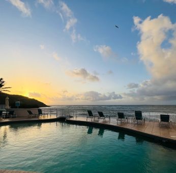 Sunset reflecting off the waters of the Infinity Pool at the Oyster Bay Resort in St. Maarten.