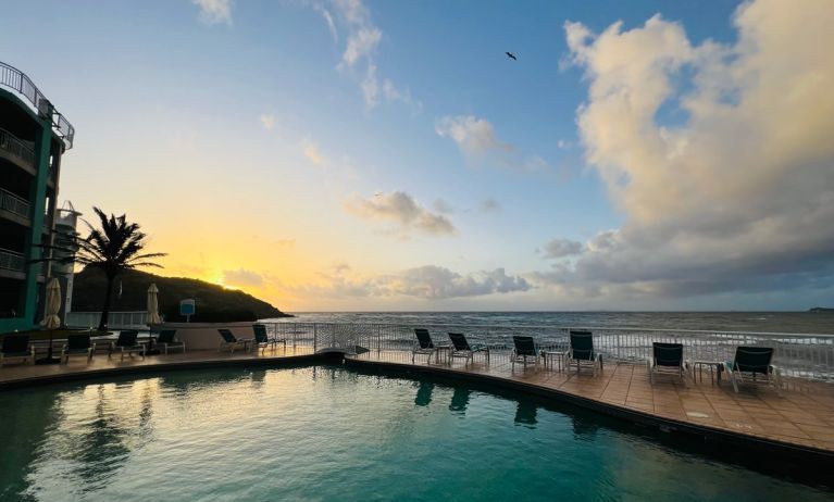 Sunset reflecting off the waters of the Infinity Pool at the Oyster Bay Resort in St. Maarten.