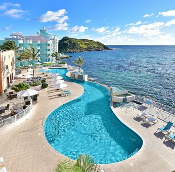 Daytime angle of glistening Infinity Pool at Oyster Bay Resort in St. Maarten.