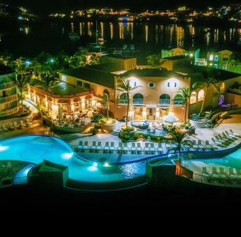 Nighttime lights of the Infinity Pool at Oyster Bay Resort in St. Maarten.