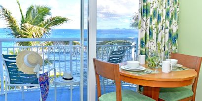 Sunset on the patio near a work desk of a day room at Oyster Bay Resort in St. Maarten.