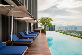 Luxurious outdoor pool with city view at Capri By Fraser Bukit Bintang.