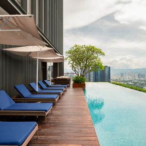 Luxurious outdoor pool with city view at Capri By Fraser Bukit Bintang.