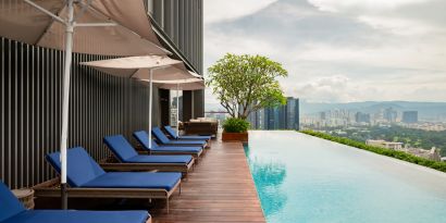 Luxurious outdoor pool with city view at Capri By Fraser Bukit Bintang.