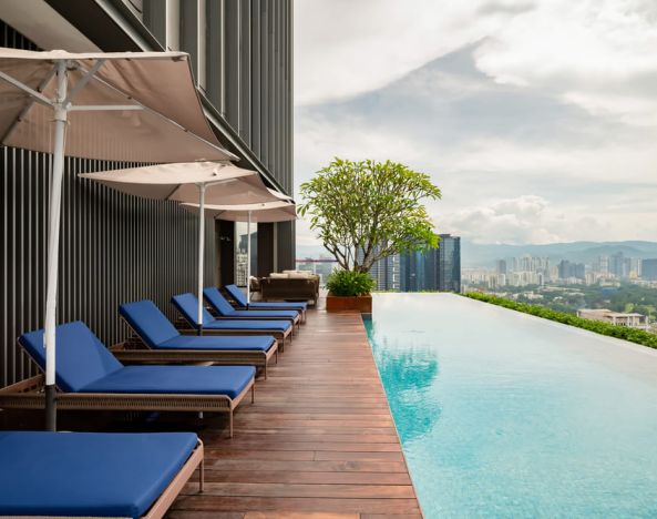 Luxurious outdoor pool with city view at Capri By Fraser Bukit Bintang.