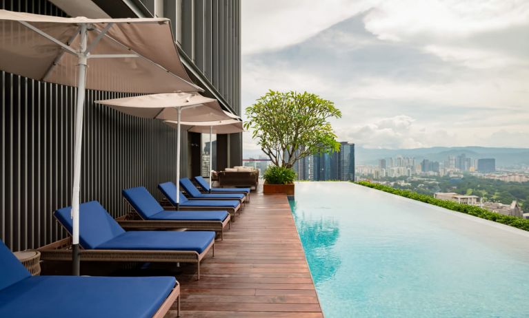 Luxurious outdoor pool with city view at Capri By Fraser Bukit Bintang.