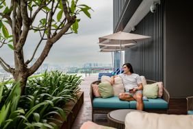 Outdoor pool with pool chairs at Capri By Fraser Bukit Bintang.