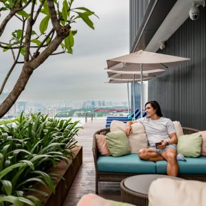 Outdoor pool with pool chairs at Capri By Fraser Bukit Bintang.