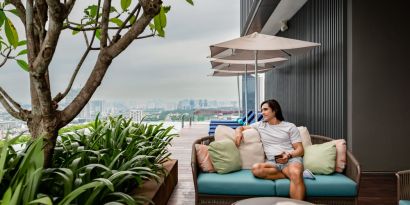 Outdoor pool with pool chairs at Capri By Fraser Bukit Bintang.