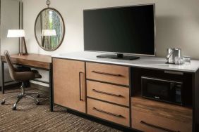 Work space with desk and TV at DoubleTree By Hilton Ontario Airport.