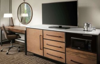 Work space with desk and TV at DoubleTree By Hilton Ontario Airport.