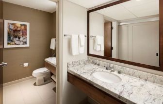 Day room with guest bathroom at DoubleTree By Hilton Ontario Airport.